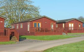 Primrose Lodge 1- 4-6 Persons With Private Hot Tub-Pet Friendly-Tranquil Holiday Away From It All Yet Not Far From St Austell- The Holiday Home Has Two Bedrooms, Living And Dining Area, Equipped Kitchen-Decking-Outdoor Furniture-Fishing Lakes-Pet Fri
